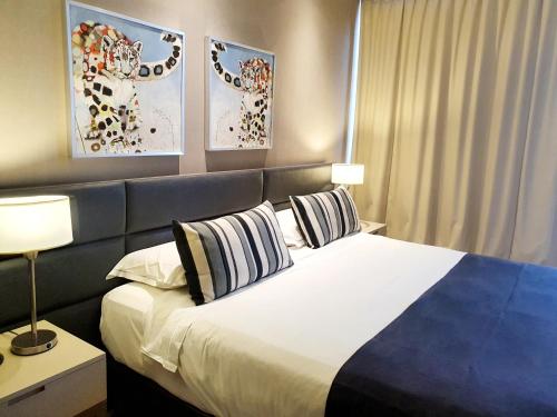 Posteľ alebo postele v izbe v ubytovaní GrandView Hotel Buenos Aires