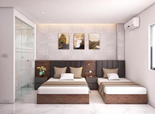 a bedroom with two beds in a room at Anh Nguyet Da Nang Hotel in Da Nang