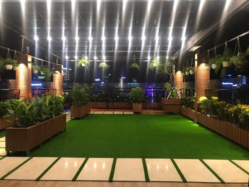 a indoor garden with plants and lights in a building at Anh Nguyet Da Nang Hotel in Da Nang
