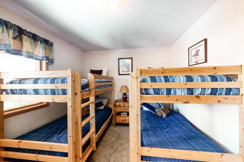a bedroom with three bunk beds in a house at Lagoon 737C in Frisco