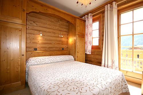 Cama o camas de una habitación en Appartement de 2 chambres avec jardin amenage et wifi a Chatel