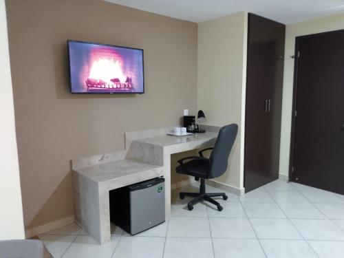 TV a/nebo společenská místnost v ubytování EXECUTIROOMS VERACRUZ