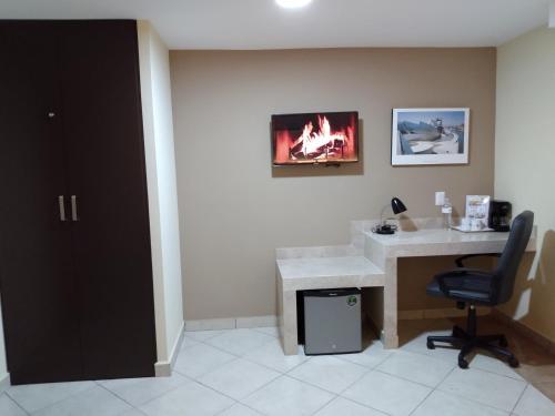 TV a/nebo společenská místnost v ubytování EXECUTIROOMS VERACRUZ