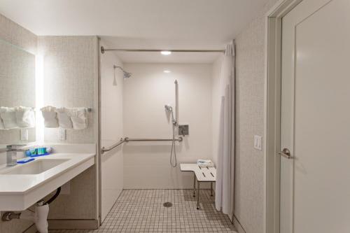 a bathroom with a sink and a shower at Holiday Inn Express & Suites Pasadena - Los Angeles by IHG in Pasadena