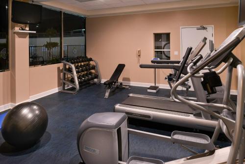 a gym with treadmills and a treadmill and weights at Holiday Inn Express & Suites Pasadena - Los Angeles by IHG in Pasadena