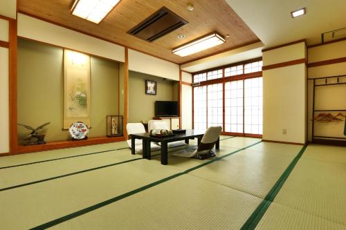 a living room with a table and a couch at Toyofuku in Kobe