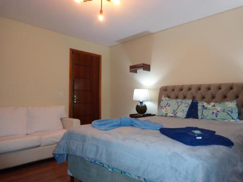 מיטה או מיטות בחדר ב-Monte Verde Inn Suítes com Hidromassagem dupla