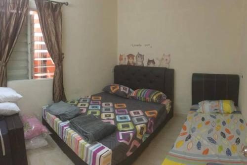 Katil atau katil-katil dalam bilik di Tambun homestay