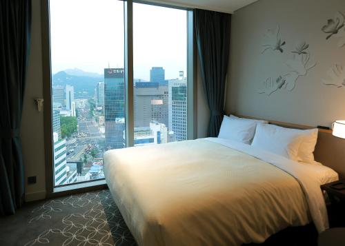 Ένα ή περισσότερα κρεβάτια σε δωμάτιο στο Hotel Gracery Seoul