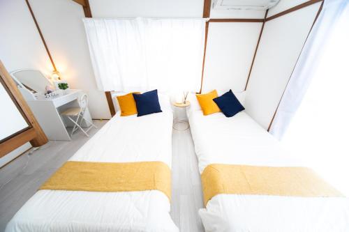 Postel nebo postele na pokoji v ubytování Takashima Lakeside Resort in Kitage