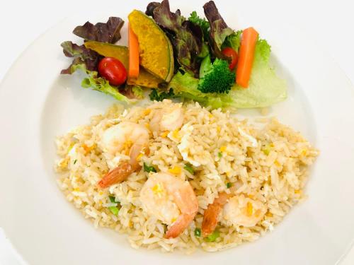 a plate of rice with shrimp and a salad at Royal View Resort - Rang Nam in Bangkok