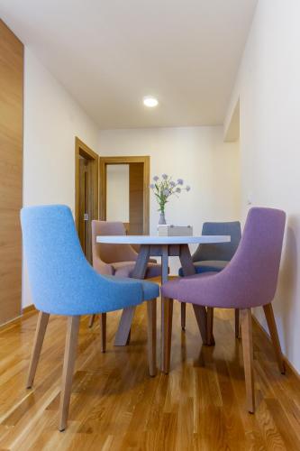 a dining room with two chairs and a table at Nirvana 06 in Zlatibor