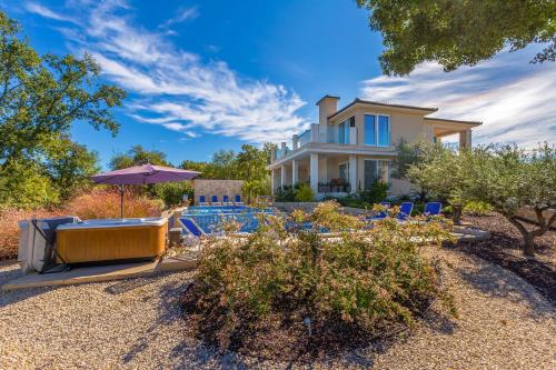 a backyard with a pool and a house at Villa Roko in Malinska