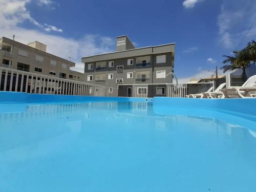 a view of the hotel from the swimming pool at Pousada Gomes in Florianópolis