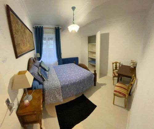 Postel nebo postele na pokoji v ubytování Chambres d'hôtes et Gîte Delia