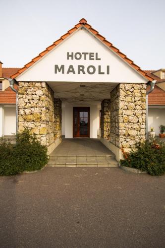 a building with a hotel marcu sign on it at Hotel Maroli Mikulov in Mikulov