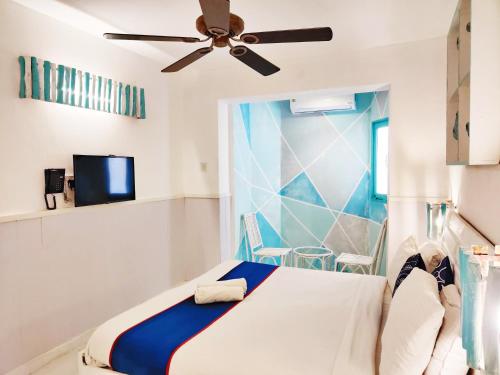 Ένα ή περισσότερα κρεβάτια σε δωμάτιο στο Eros Boutique Hotel