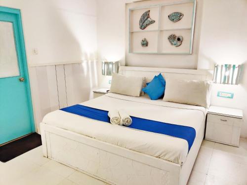 Ένα ή περισσότερα κρεβάτια σε δωμάτιο στο Eros Boutique Hotel