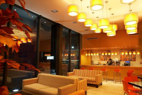 a lobby with chairs and a bar in a restaurant at Hotel Restaurante El Valles 4 ESTRELLAS in Briviesca