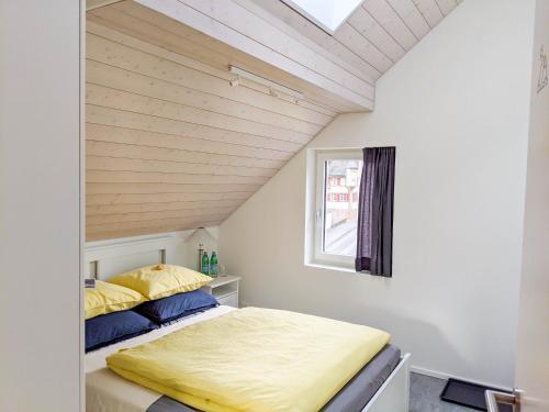 a bedroom with a bed and a window at Budget rooms Pilatus - Alpnachstad in Alpnachstad