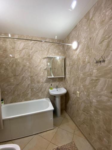 Ванная комната в Apartment on Leninskiy prospect 124b