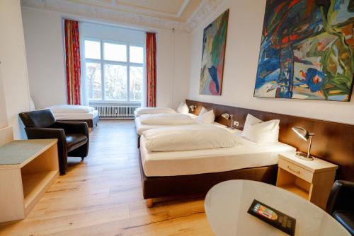 Кровать или кровати в номере Hotel Tiergarten Berlin