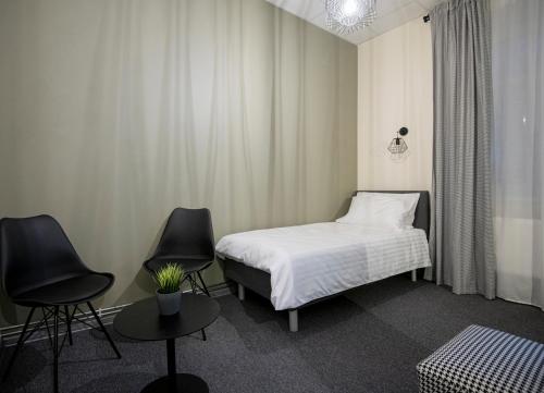 En eller flere senge i et værelse på RUMI Hotel with Self Check-In