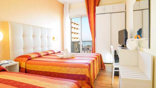 Postel nebo postele na pokoji v ubytování Hotel Tridentum