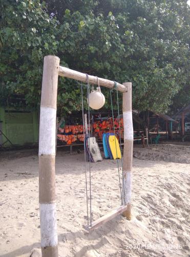 a basketball hoop with a light in the sand at pulau weh sabang marifi in Paya