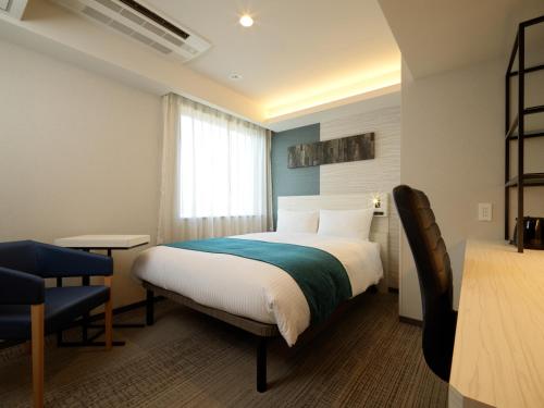 Postel nebo postele na pokoji v ubytování Hotel Emisia Tokyo Tachikawa
