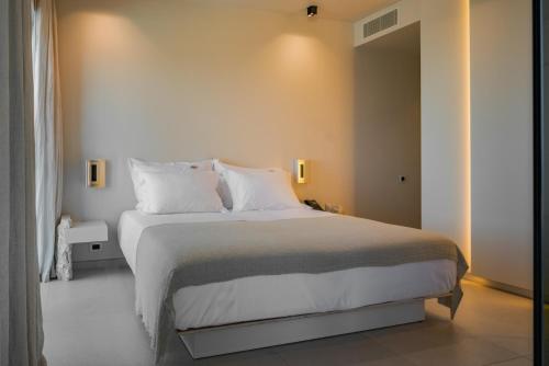 Ένα ή περισσότερα κρεβάτια σε δωμάτιο στο Milos Cove