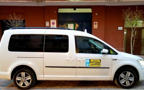 a white van parked in front of a building at Alba Ionica Taranto in Taranto