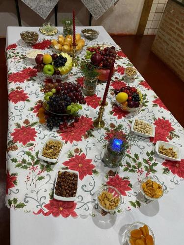 a table with many different types of food on it at POUSADA SERRA DA CANASTRA in Delfinópolis