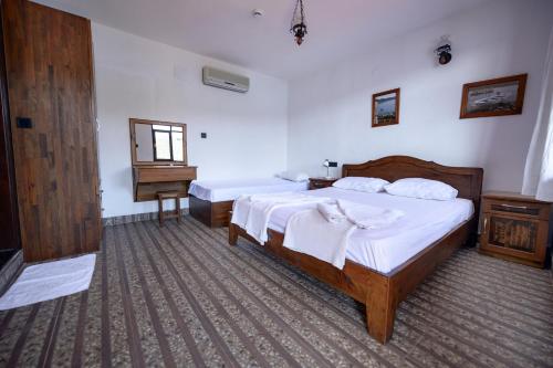 Voodi või voodid majutusasutuse Ankh Pension toas