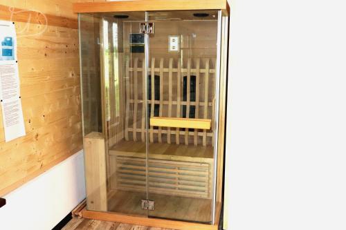 a sauna with a yellow bench inside of it at вила Ирена in Radevtsi