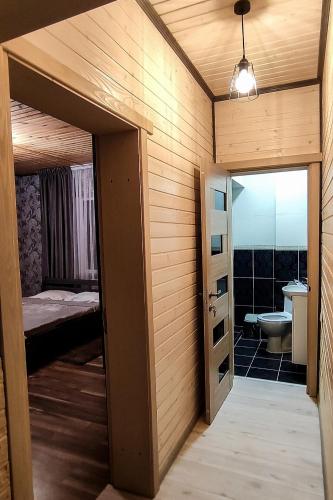 a room with a door leading to a bathroom at SOKIL HOUSE будинок з чаном та літнім басейном in Slavske