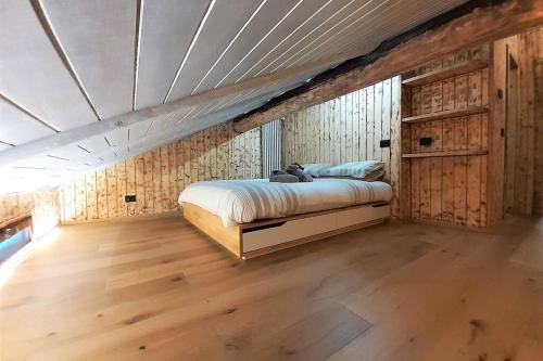 Postel nebo postele na pokoji v ubytování Dream House Quadrifoglio. Sulle piste di Folgarida,madonna di campiglio.