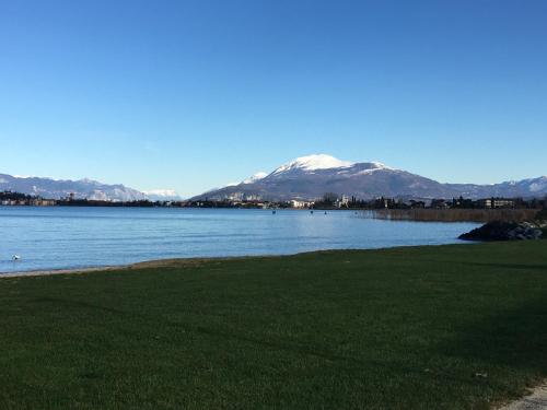 a view of a lake with mountains in the background at Hotel Villa Rosa in Sirmione