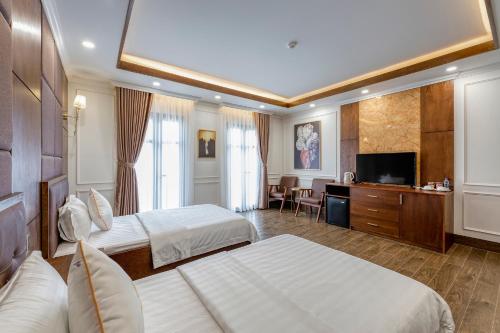Postel nebo postele na pokoji v ubytování Hotel Trí Lê