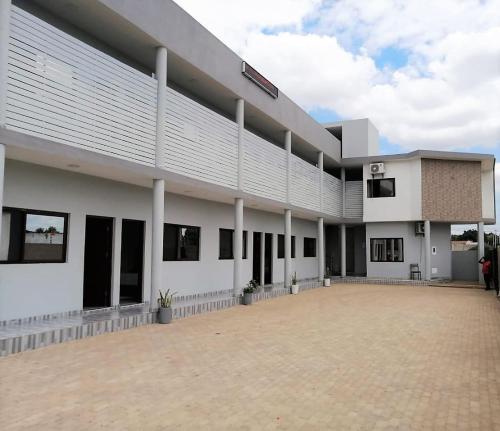 a large white building with a lot of windows at 40 40 Accommodation in Matola