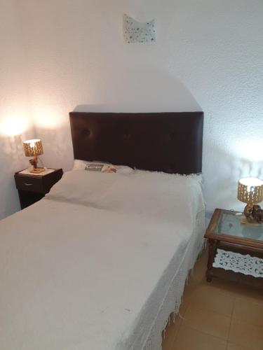 Ένα ή περισσότερα κρεβάτια σε δωμάτιο στο Miramar Panorámico