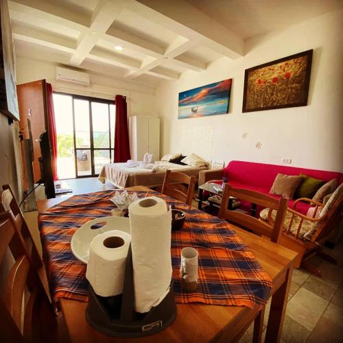 a living room with a table with paper towels on it at comft suite Nahariyya in Nahariyya