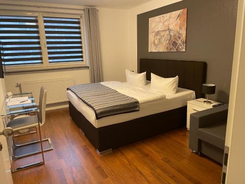 a small bedroom with a bed and a window at Hotel Teatro in Kassel