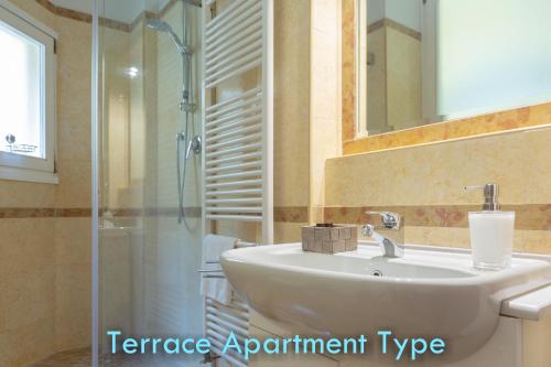 a bathroom with a sink and a shower at BolognaRoomscom - Santo Stefano Apartments in Bologna