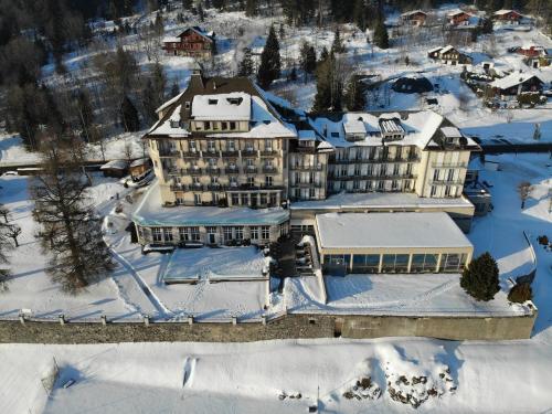 an aerial view of a hotel in the snow at Grand Hôtel des Rasses & Wellness in Les Rasses