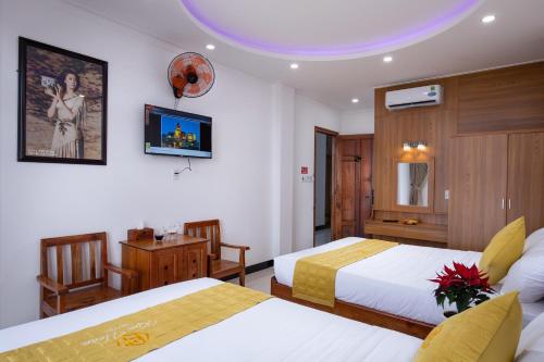 Giường trong phòng chung tại Kim Hoàn Hotel Phan Rang