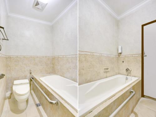 Ένα μπάνιο στο SUPER OYO 3261 Hotel Ratu