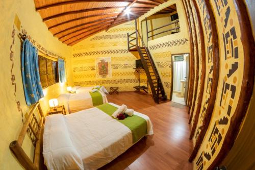 Ένα ή περισσότερα κρεβάτια σε δωμάτιο στο San Agustin Internacional Hotel
