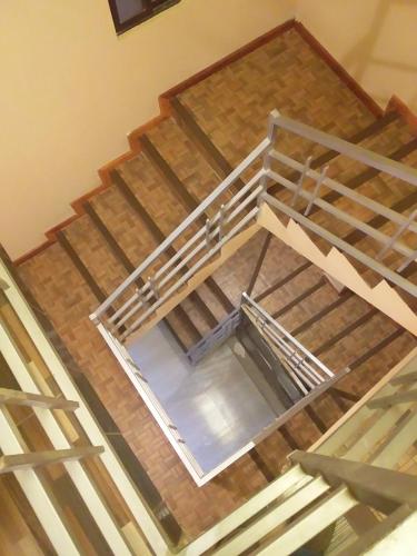 an overhead view of a metal staircase in a building at Hostal Nichkito in Uyuni