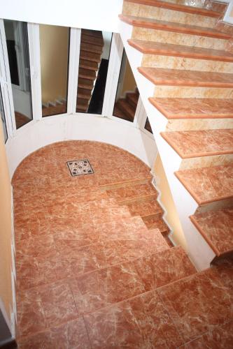 an overhead view of a staircase with brown marble floors at Rooms & Apartments Anka in Bar